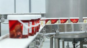 Ice Bucket & Plastic Ice Bucket Solutions for Plastic Ice Storage with Lid and Plastic Ice Buckets with Handles 1 Rows of wholesale ice cream buckets on a factory conveyor belt.