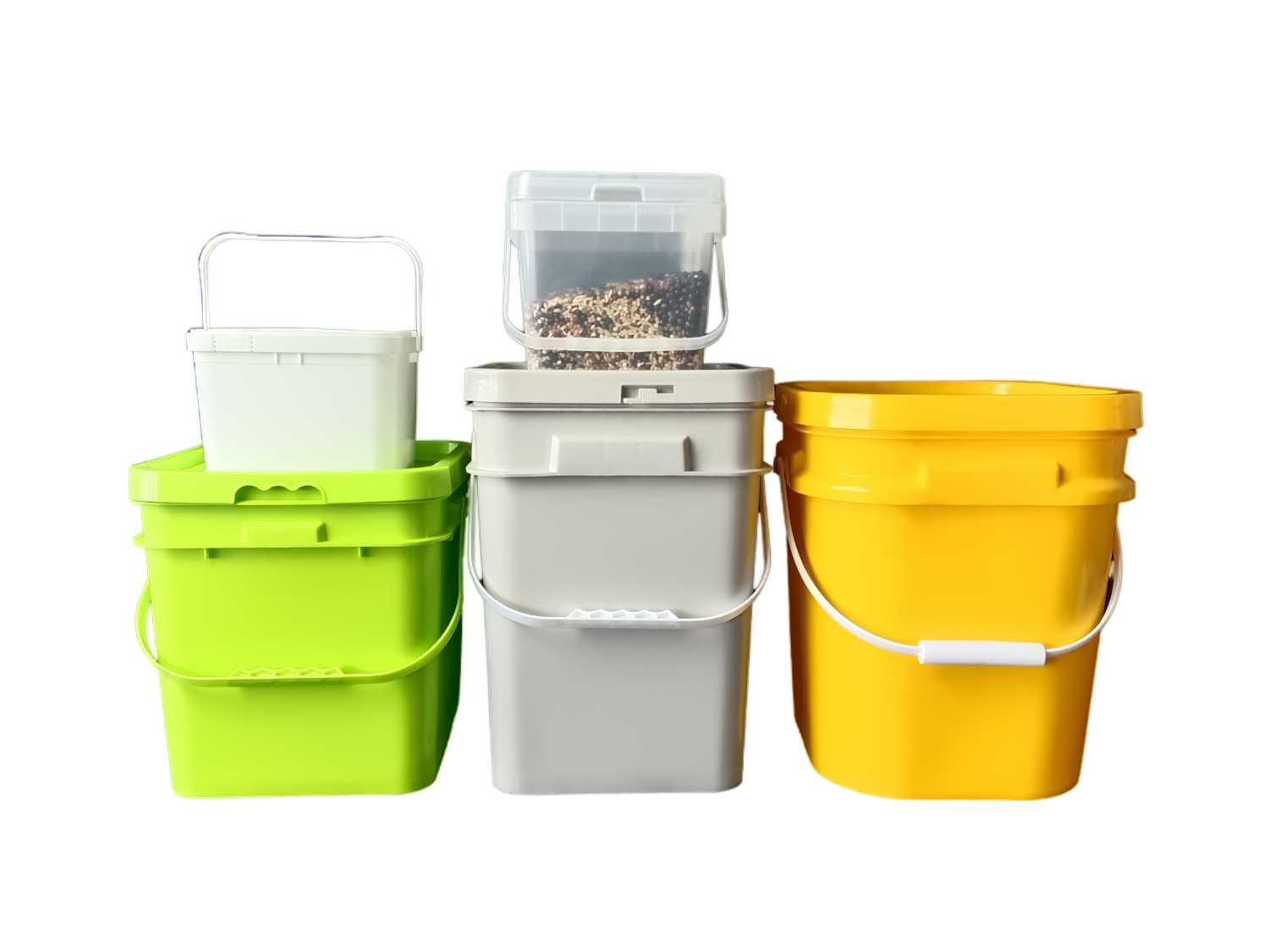 Four plastic buckets in multiple colors and shapes on white background: lime green square bucket with small white square bucket stacked on top, grey square bucket with transparent square bucket filled with mixed grains stacked on top, and yellow round bucket, all with handles
